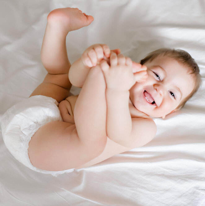 joyful baby diapers lying